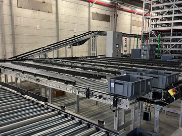 Boxes and conveyor section of a small parts conveyor system